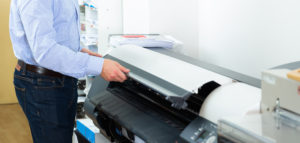 Portrait of male worker at plotter